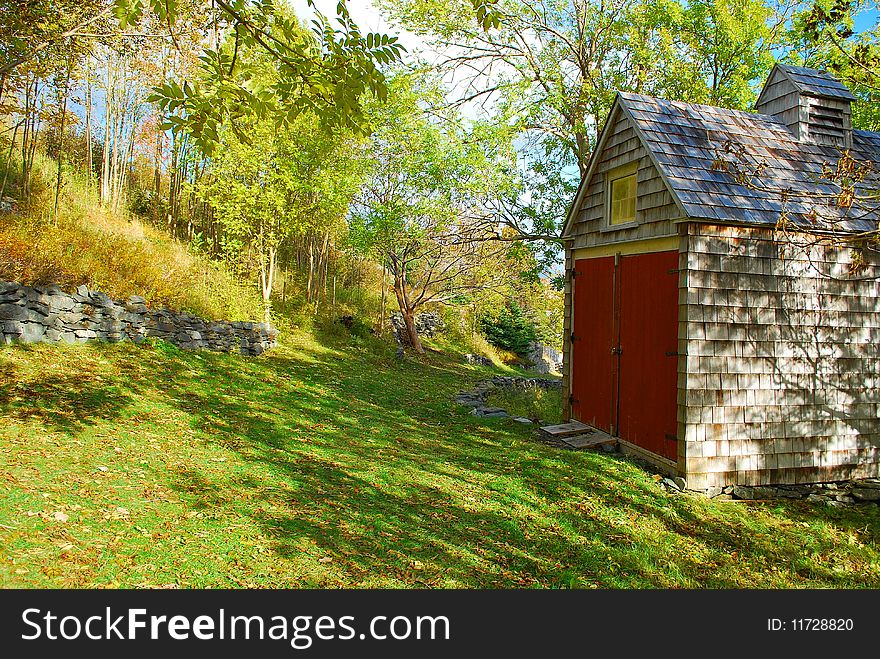 A building or shed on the side of a hill in the wooded countryside, Brighouse, Newfoundland, Canada. A building or shed on the side of a hill in the wooded countryside, Brighouse, Newfoundland, Canada