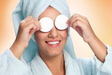 Woman Holding Cotton Pads On Her Eyes Royalty Free Stock Image