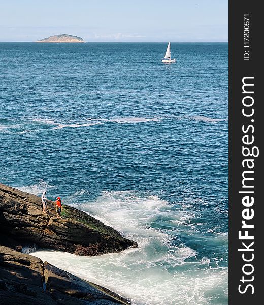 White Sailboat On Body Of Water