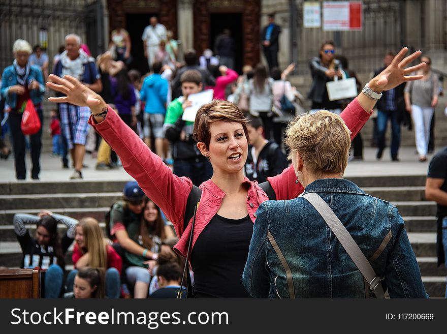 Woman Racing Hands Front Of Another Woman