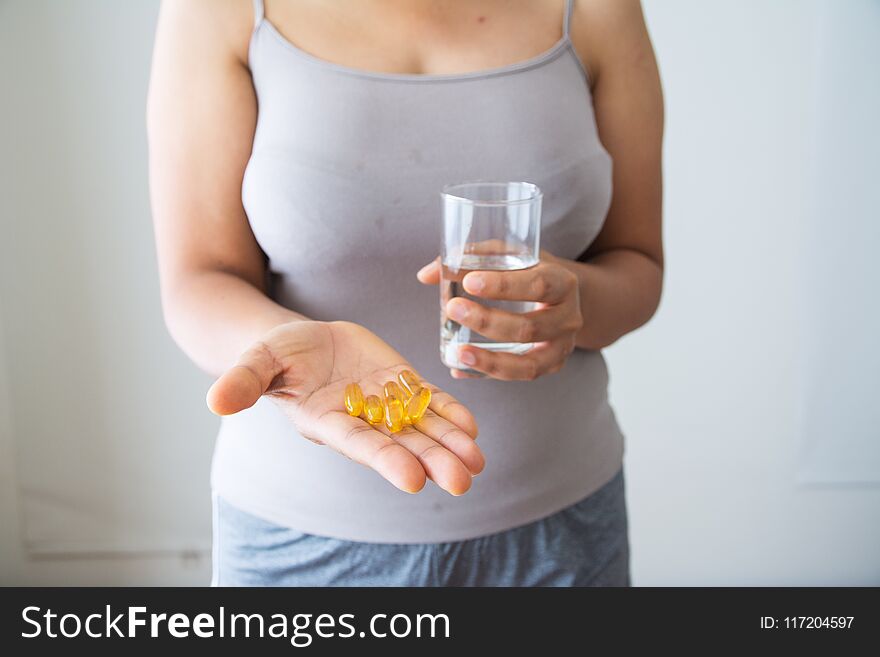 Women holding medicine and water