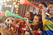 Group Of Friends Watching Soccer In Pub Royalty Free Stock Photos