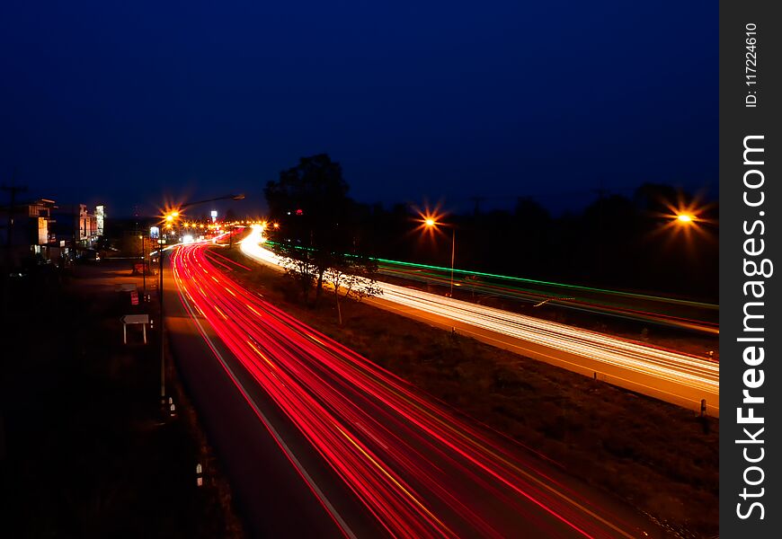 Moving car with blur light through city at night.