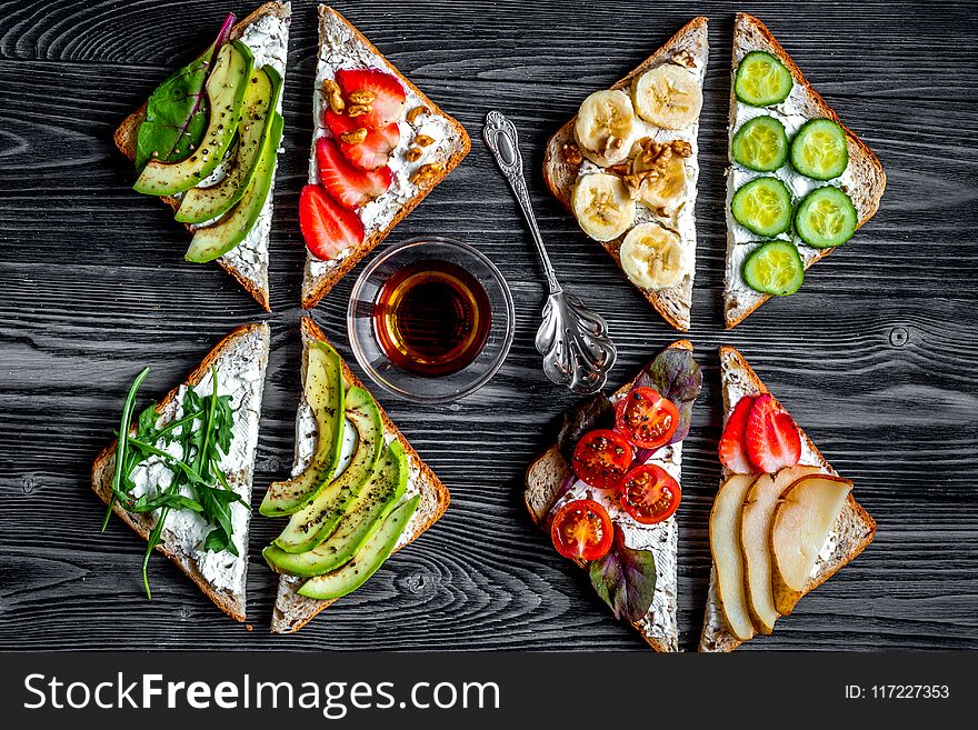 Sandwiches Set On Dark Table Background Top View