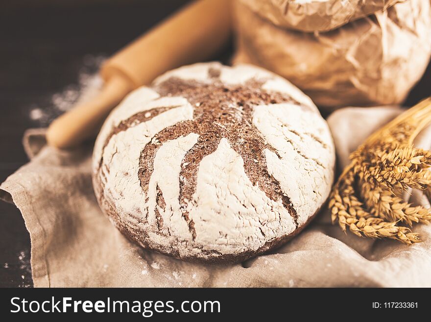 Bag of flour on wooden background