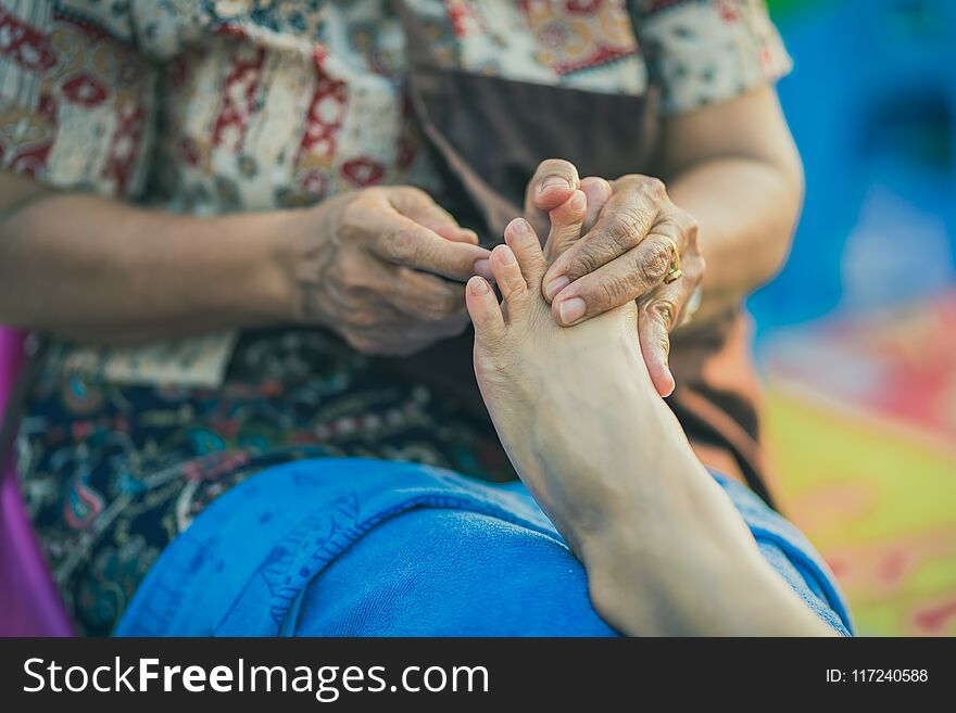 Thai foot massage on street for resting place on annual festival