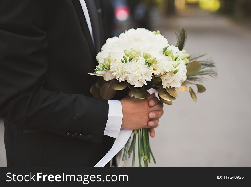 Wonderful luxury wedding bouquet of different flowers.