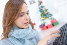 Female Working On Laptop At Christmas Time Royalty Free Stock Photography