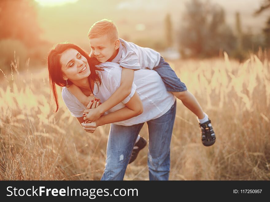 Mother with son hugging in a summer field. Mother with son hugging in a summer field