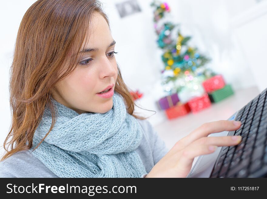 Female working on laptop at christmas time