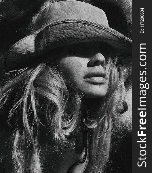 Grayscale Photography of Woman Wearing Hat