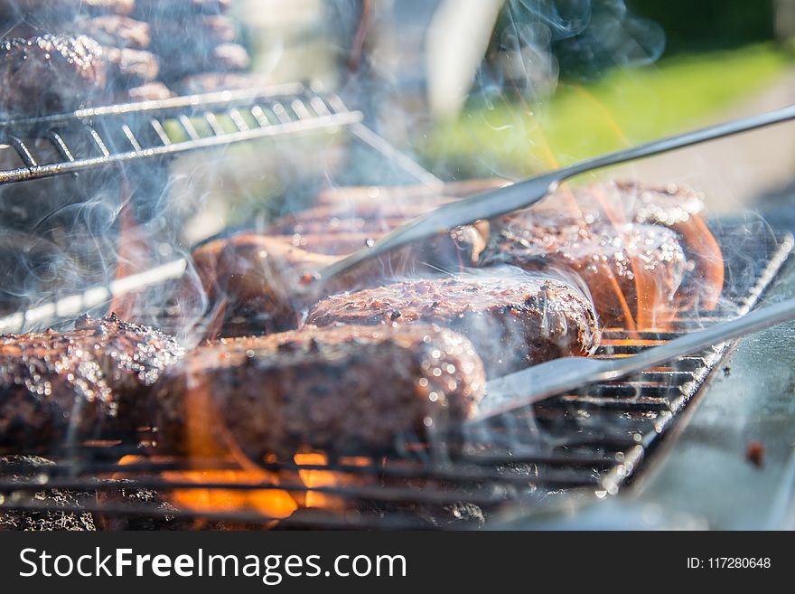Close Photography of Grilled Meat on Griddle