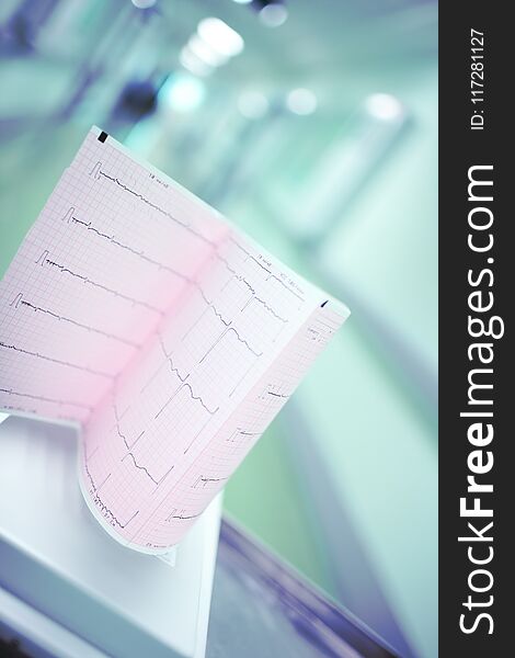 Heart examination test result on the background of blurred hospital corridor