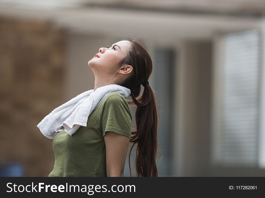 Female Take A Break After Exercising