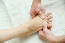 Massage Of Feet And Legs. Royalty Free Stock Image