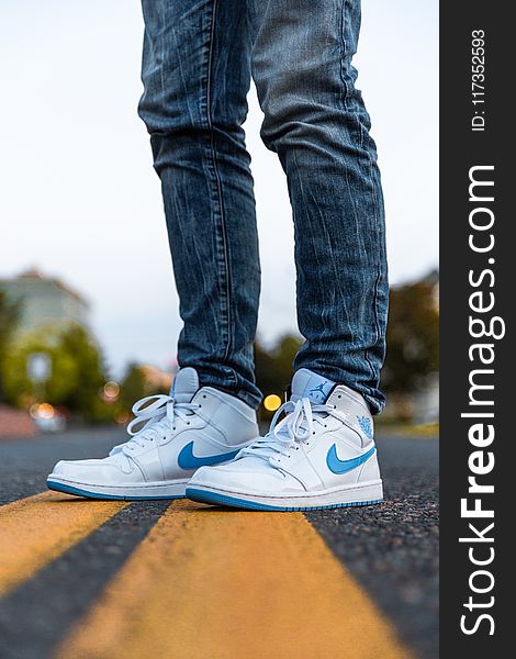 Person Wearing White And Blue Air Jordan 1&#x27;s