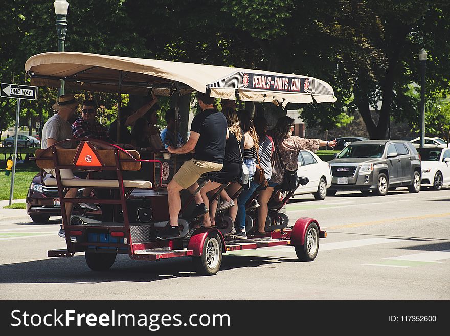 Photograph Of People Riding On Vehicle