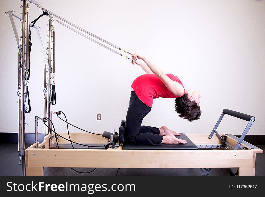 Woman Using Exercise Equipment