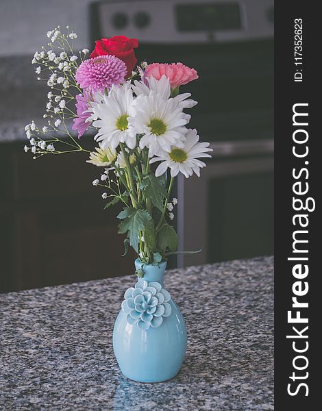 Assorted Flowers in Blue Vase