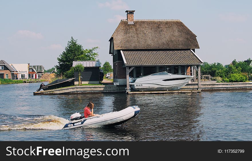 Person on White Inflatable Speed Boat