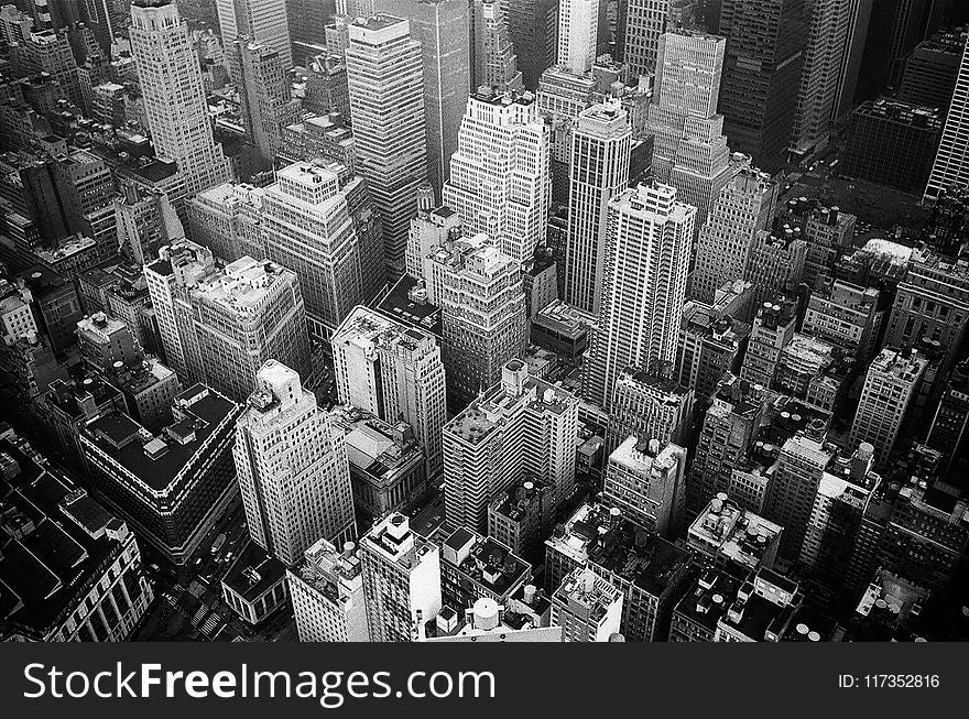 Aerial View and Grayscale Photography of High-rise Buildings