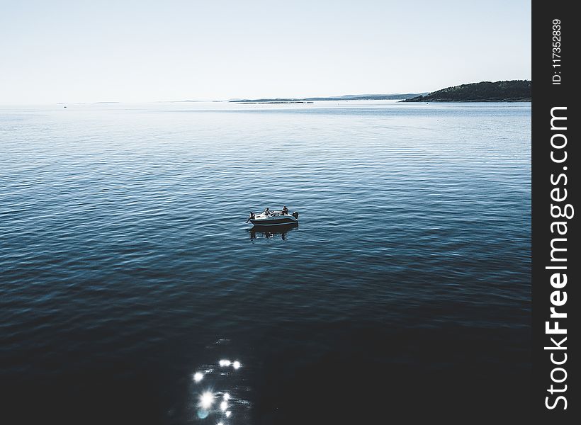 Two Person Riding Boat