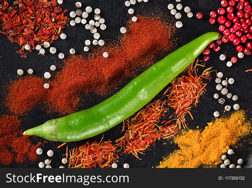 Spicy background with Fresh Chili pepper. Top view