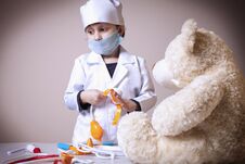 Cute Little Child Girl Playing Doctor With Teddy Bear Royalty Free Stock Image