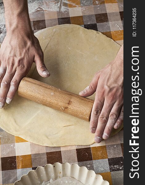 Cooking And Home Concept - Close Up Of Male Hands Kneading Dough