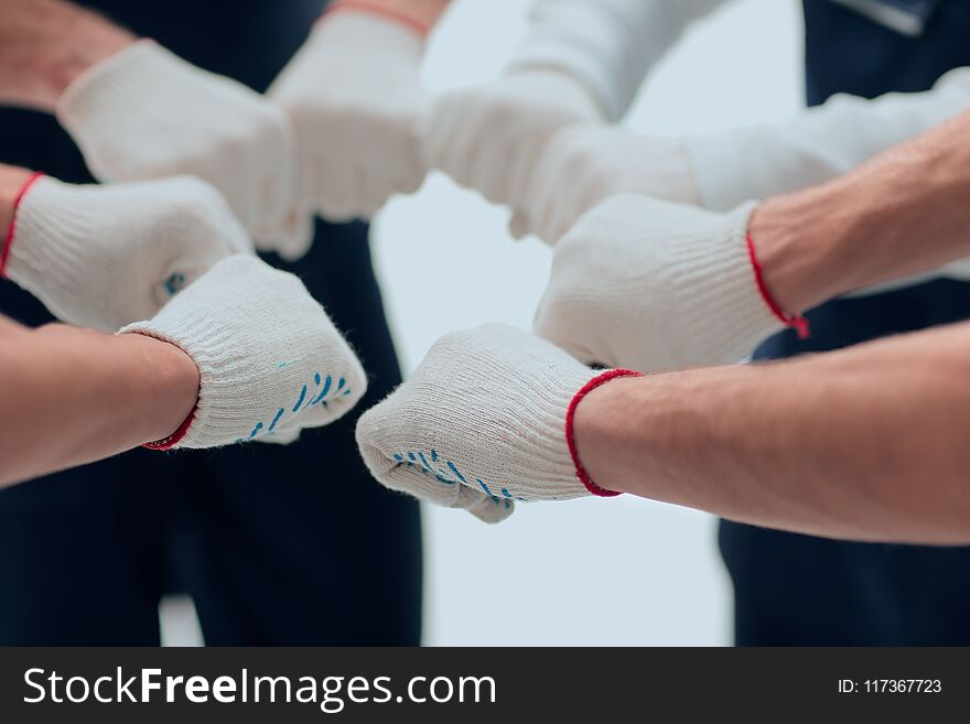 Large group of workers standing in circle.concept of teamwork. Large group of workers standing in circle.concept of teamwork