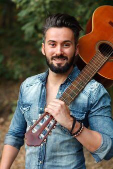 Free Attractive Guy With Clasic Guitar Stock Photo - 117370420