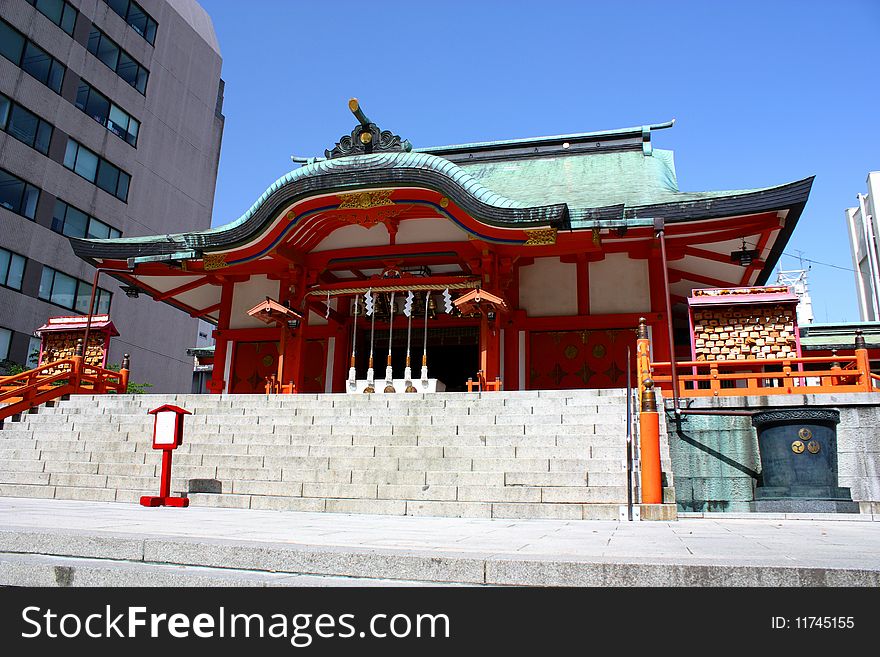 Hanazono Shinto Shrine and office building in Tokyo's Shinjuku ward. Hanazono Shinto Shrine and office building in Tokyo's Shinjuku ward