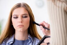 The Woman Getting Her Make-up Done In Beauty Salon Royalty Free Stock Photo