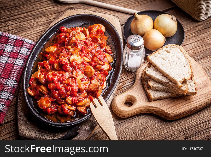 Lecho - tasty Hungarian stew with peppers and sausage. Lecho - tasty Hungarian stew with peppers and sausage.