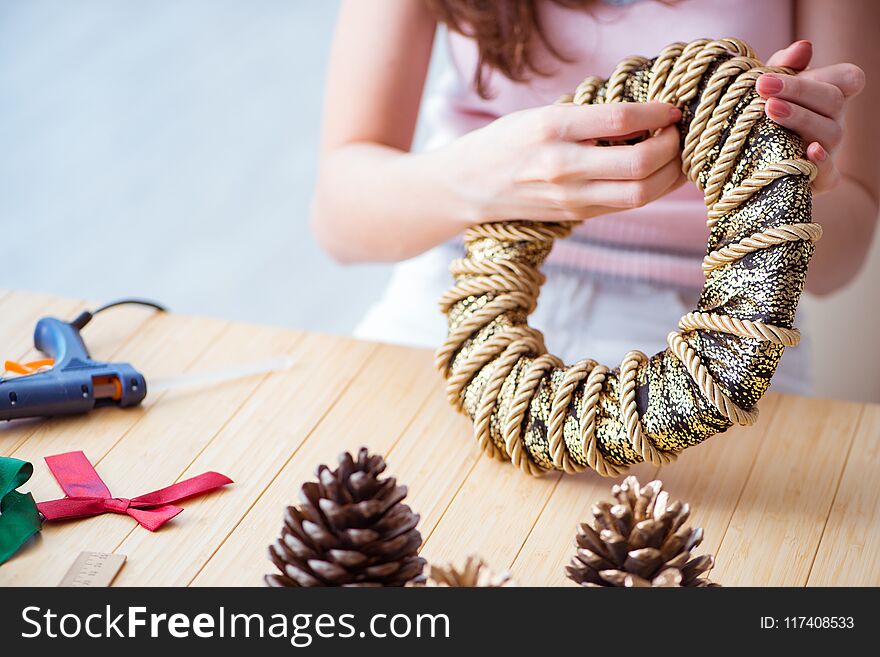The woman doiing diy festive decorations at home