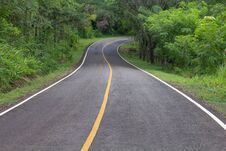 Curve Way Of Asphalt Road Through The Tropical Forest Royalty Free Stock Photo