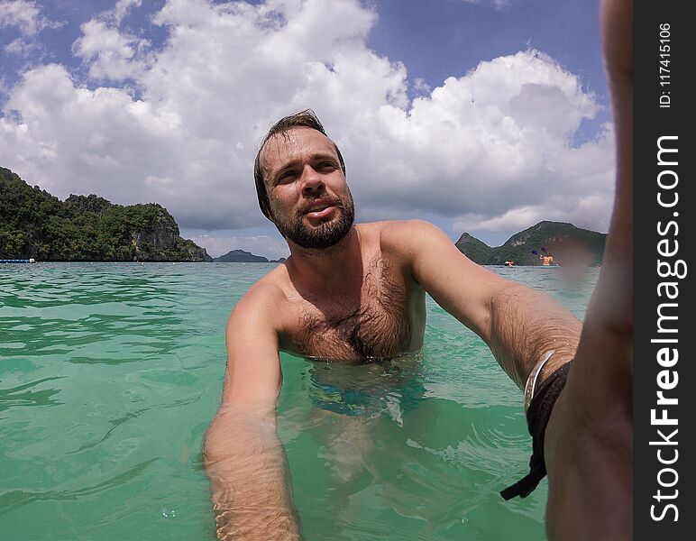 Man model scuba diving in summer thailand