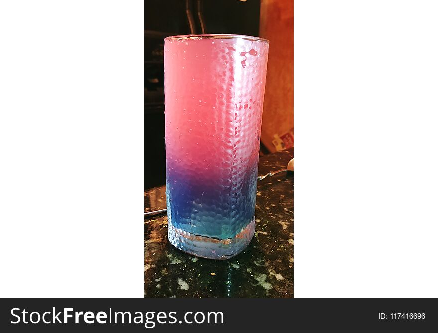 Pink Tampico, mixed with Strawberry Vodka, with a splash of Blue Curacoa. Pink Tampico, mixed with Strawberry Vodka, with a splash of Blue Curacoa.