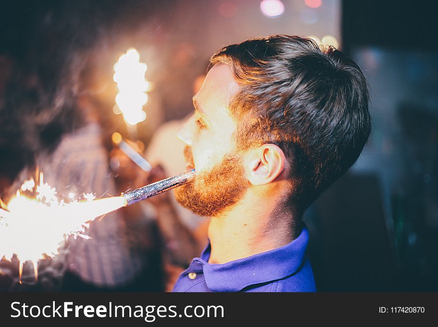 Person Holding Fireworks By Mouth