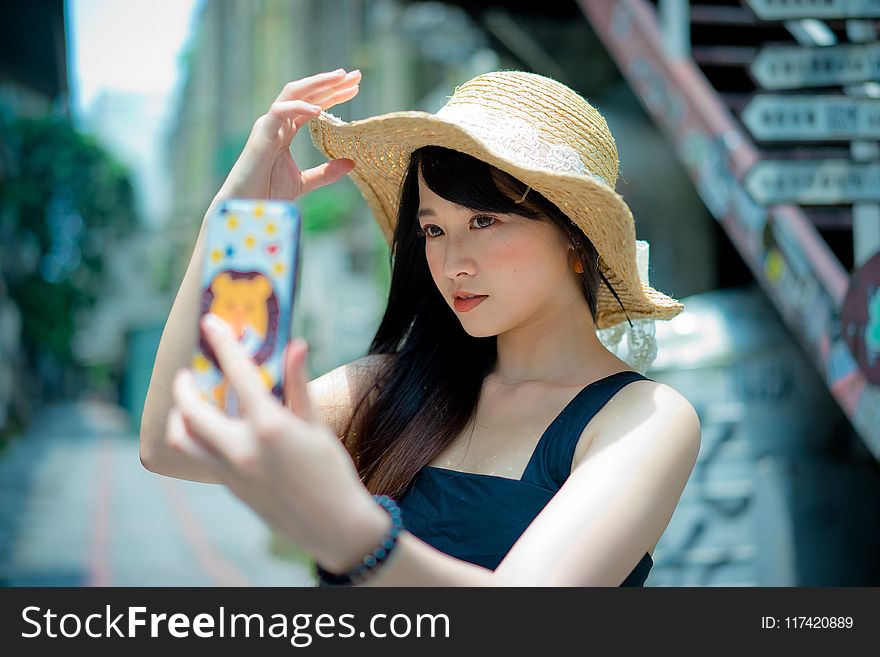 Woman Wearing Brown Summer Hat