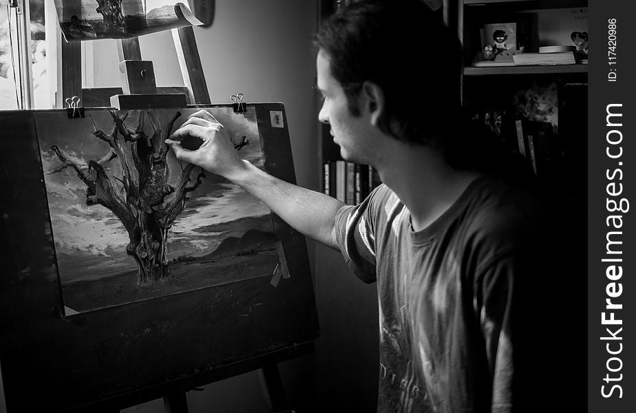 Grayscale Photography of Man Painting a Tree