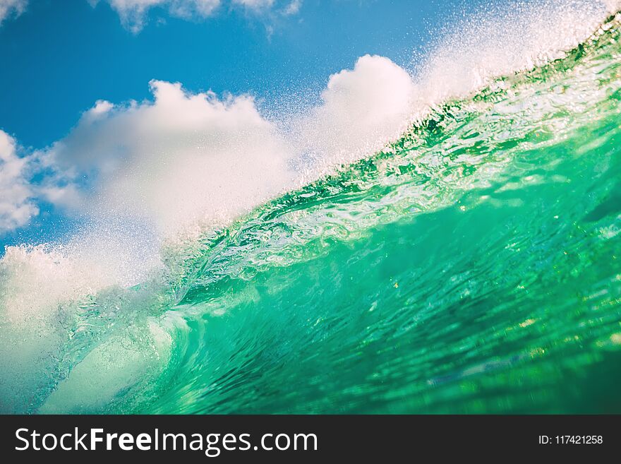 Crystal Green Wave In Ocean. Breaking Wave And Evening Light