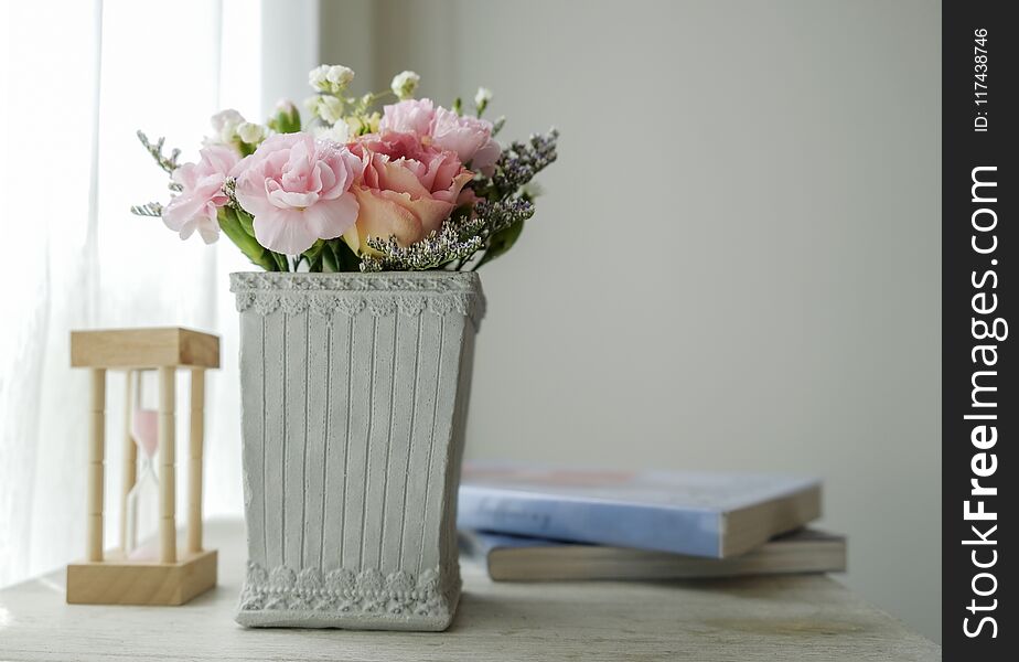 Carnation flower in cement pot on vintage cabinet at the bedroom with copy space