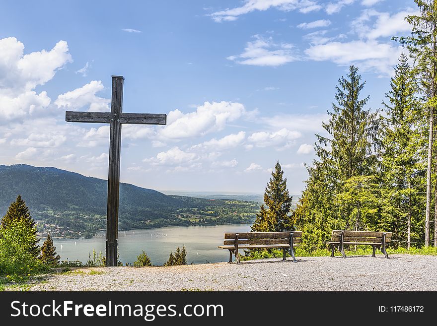 Black Cross Near Body of Water