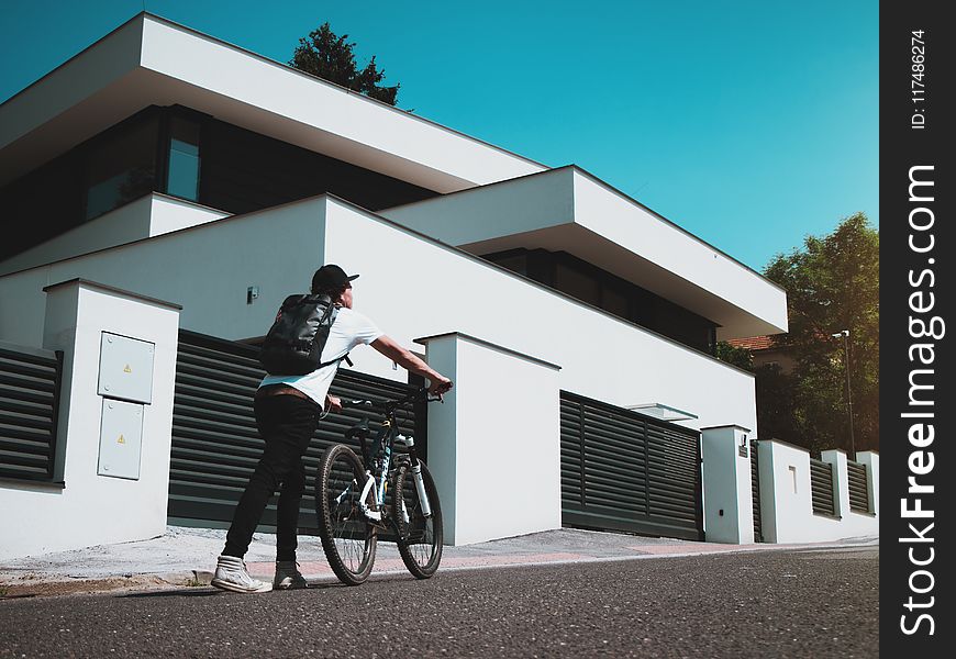 Man Holding Bike