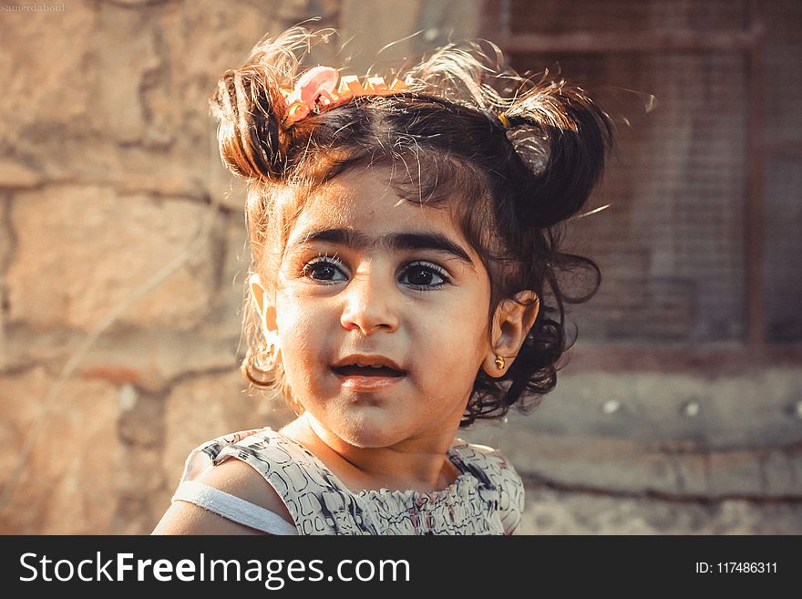 Shallow Focus Photography of Child in Gray Top