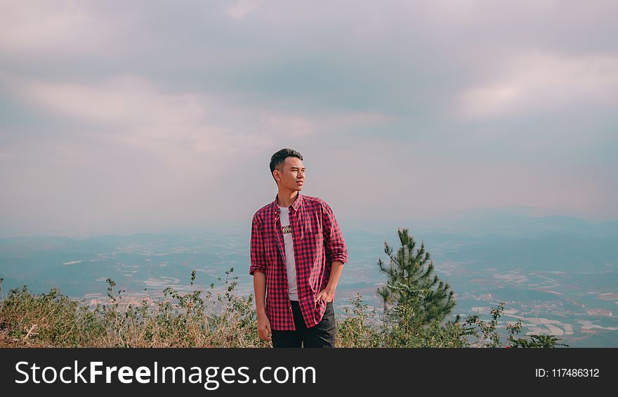 Man in Red Button-up Shirt Standing