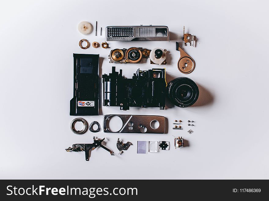 Flat Lay Photography of Black and Gray Components on White Surface