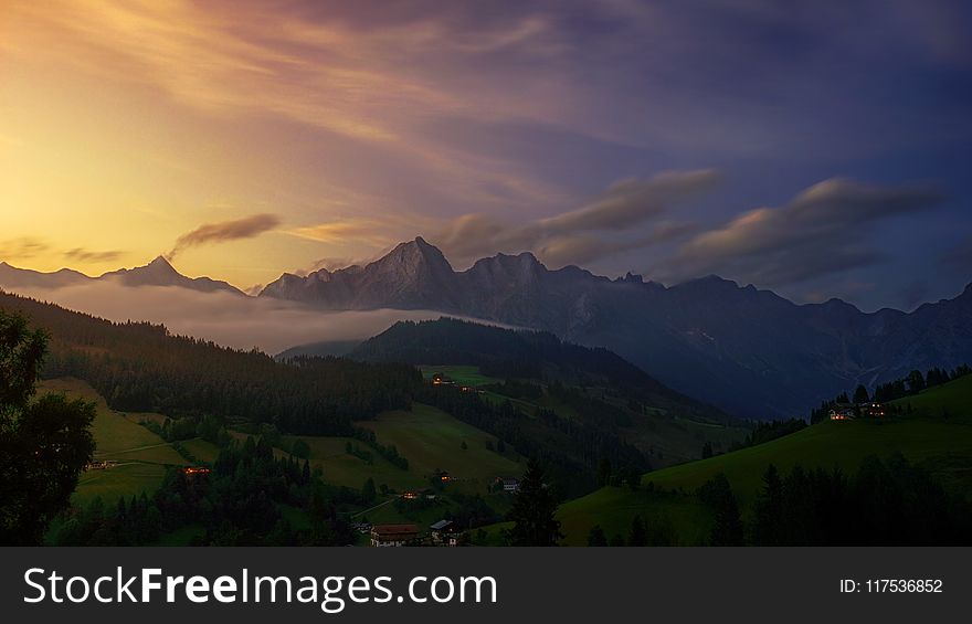 Aerial View Photography Of Mountain Under Cloudy Sky