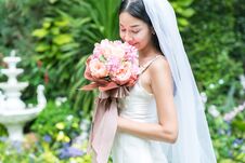 Bride Holding A Bouquet In The Garden. Stock Photos